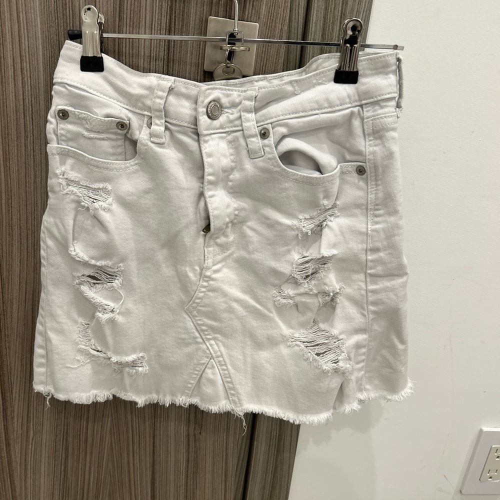 White ripped denim skirt